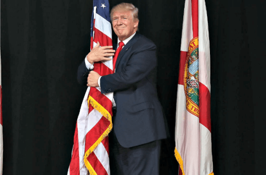 trump-hugs-flag-in-tampa